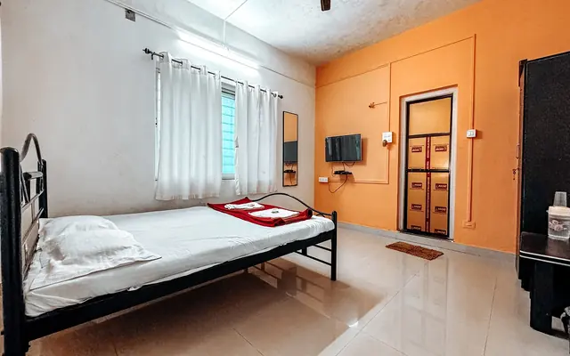 Executive room at Airawat with warm orange walls