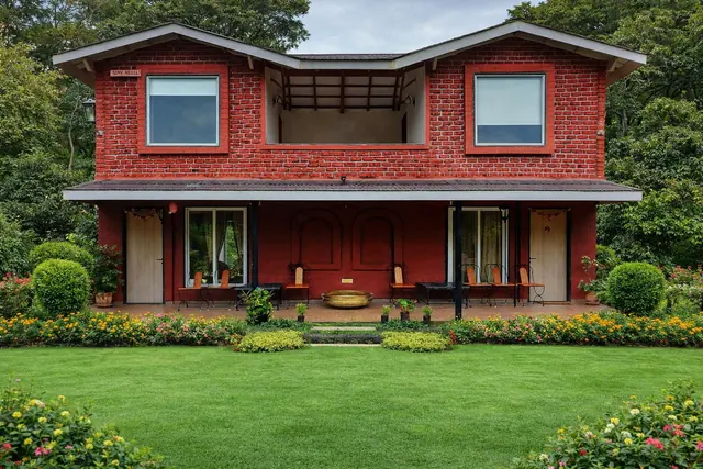 The Little Red Cottage, a red brick house with a front lawn